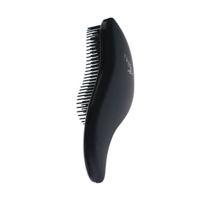 Detangle brush. tangle in hair. detangle hair. anti-frizz hair brush. soft touch hair brush. 